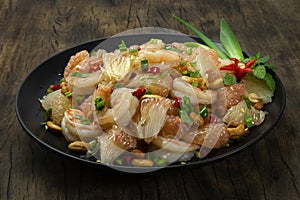 Spicy Pomelo Salad with Srimps GoodTasty Appetizer Dish on Black Plate  Healthyfood or diet photo