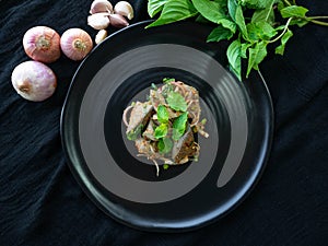 Spicy Pork Liver Salad,Ingredient Onion,Roasted rice,Basil,Pepper,On a black plate,Thai Street Food