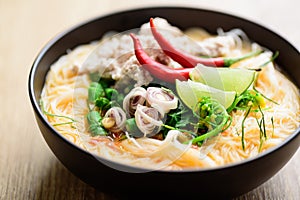 Spicy rice noodles soup with spices and herbs Thai Tom Yum