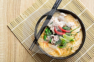 Spicy rice noodles soup with spices and herbs Thai Tom Yum