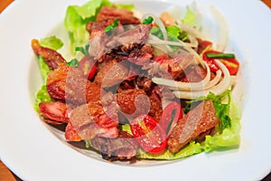 Spicy salad with Crispy Pata (deep fried pork leg) photo