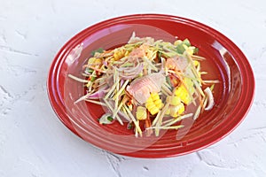 Spicy salmon salad put on marble table