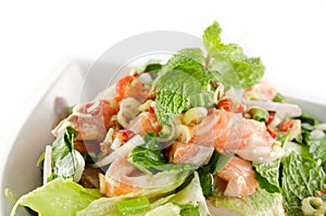 Spicy salmon salad on white background