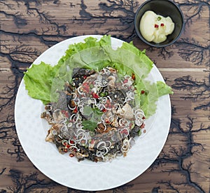 Spicy salmon skin salad with Thai ingredient style