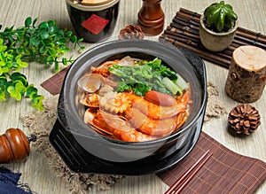 Spicy Sanxian Rice Noodles in Casserole isolated on mate top view of chinese food table