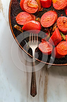 Spicy Sausage Peppers and Onions