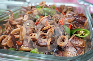 SPICY SAUTEED SQUID WHICH BLEND WITH GREEN AND RED CHILI, WITH SELECTIVE FOCUS