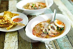 Spicy seafood soup with noodle and boiled egg