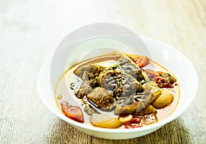 Spicy shanks soup in bowl