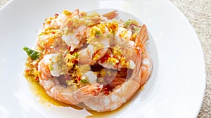 Spicy Shrimp Salad with Garlic chilli fish sauce and lemon in a plate