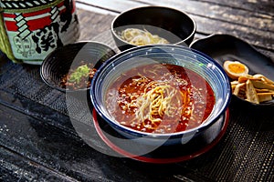 Spicy Sichuan Dandan noodles ramen unassembled in the traditional Japanese ramen restaurant