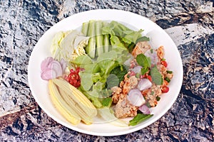 Spicy sour carp eggs of silver barb fish salad photo