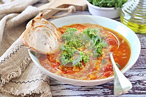 Spicy split  pea soup with cabbage kale, olive oil and bread