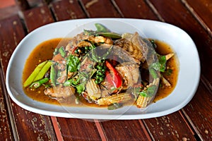 Spicy stir-fried fish with pepper, chili . Stir fried fish with Thai herbs, spicy local food, the unique spice of Thai food. image