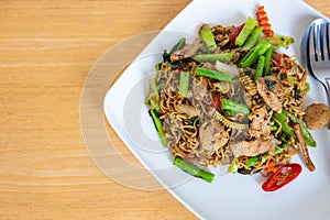 Spicy stir fried instant noodle and holy basil leaves