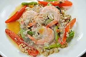Spicy stir fried minced pork and shrimp with basil leaf on plate