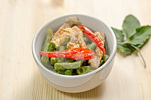 Spicy stir fried pork with red curry paste and Yard Long bean