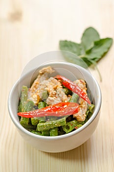 Spicy stir fried pork with red curry paste and Yard Long bean