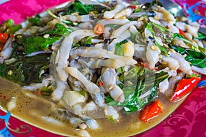 Spicy stir fried Solen strictus with red curry and crispy basil