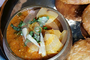 Spicy and tangy Aalu or potato sabji or curry