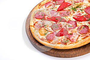 Spicy tasty pizza with salami and red pepper