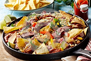 Spicy Tex-Mex beef entrecote steak with nachos photo