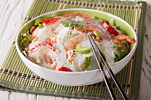 Spicy Thai salad yam woon sen with seafood close up. horizontal