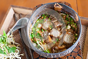 Spicy TOM YAM noodle soup with crispy pork