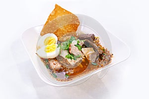 Spicy tom yum noodle with egg.