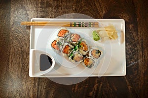 Spicy tuna roll with wasabi, ginger and soy sauce
