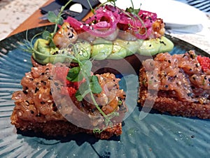 Spicy Tuna Tartare On Fried Sushi Rice And Teriyaki Shrimps With Avocado Mash