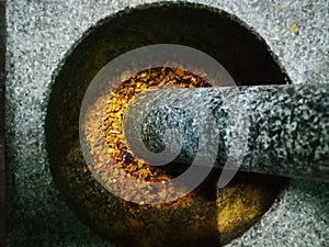 Red spicy machine in vintage stone mortars