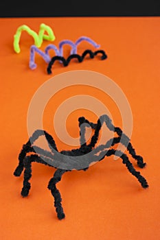 Spider for Halloween craft, black on orange.