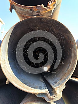 a spider web in the destroyed launcher