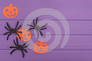 The spiders and pumpkins halloween silhouettes cut out of paper