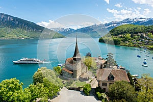 Spiez castle with cruise ship on lake Thun in Bern, Switzerland photo