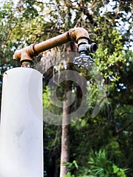 Spigot Metal and Cooper Upside Down Attached to a PVC Pipe