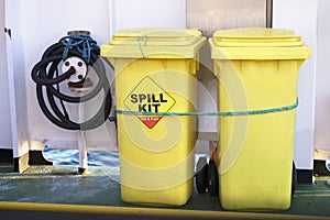 Spill kit yellow wheelie bin for health and safety of chemical, oil, diesel or petrol leak