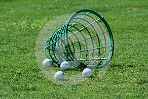 Spilled bucket of practice golf balls