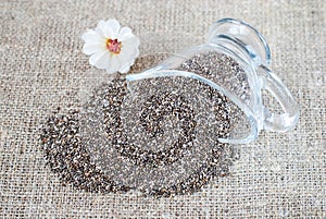 Spilled chia seeds on a linen tablecloth