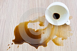 Spilled coffee cup stain on wooden floor