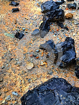 Spilled crushed coal after rain