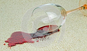 A spilled glass of red wine