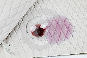 a spilled glass of wine on the tablecloth. Cleaning clothes and furniture from stains.