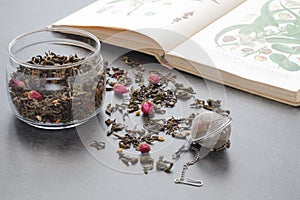 Spilled green tea with a rose on stone table