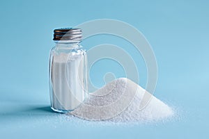 Spilled salt and salt shaker