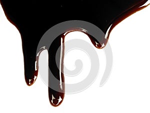 Spilled soy sauce sauce puddle isolated on white background.