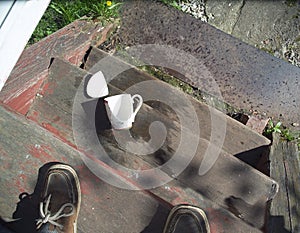 Spilled tea and broken cup