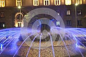 Spilled water from the fountain in front of the presidential photo shoot stop at night