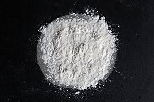 Spilled White Baking Flour on Black Background